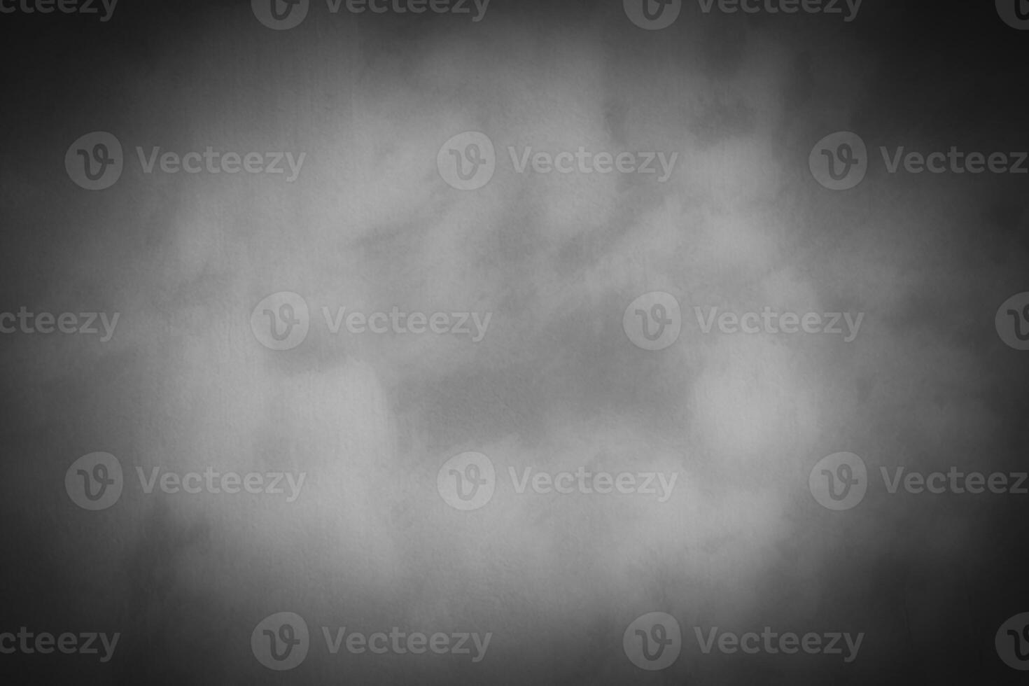 Blured gray decorative plaster or concrete background with vignette. photo