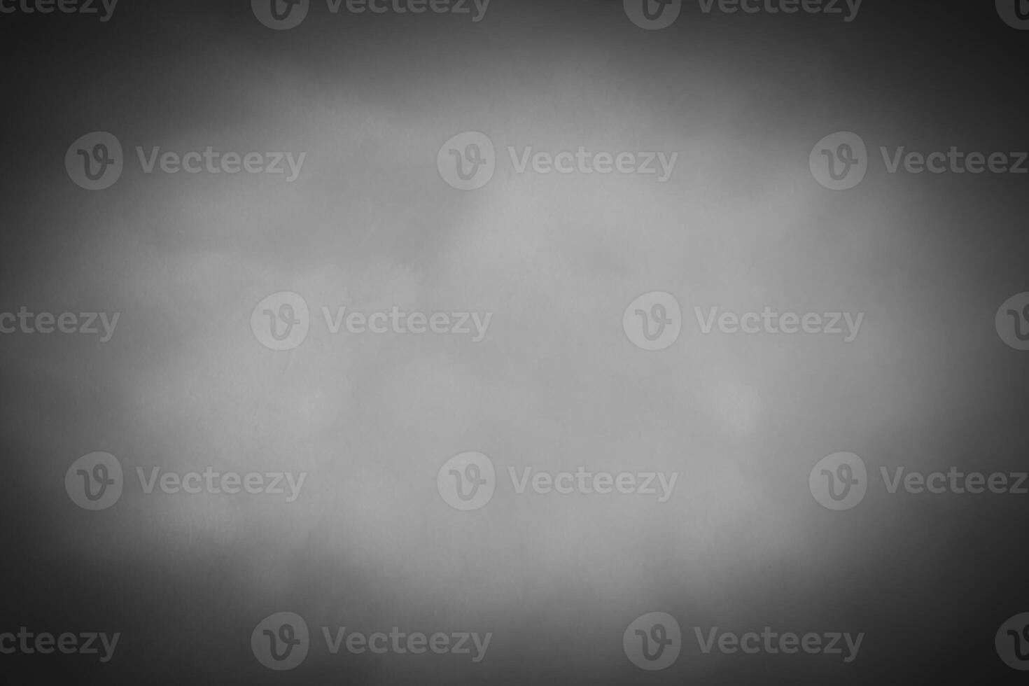 Blured gray decorative plaster or concrete background with vignette. photo