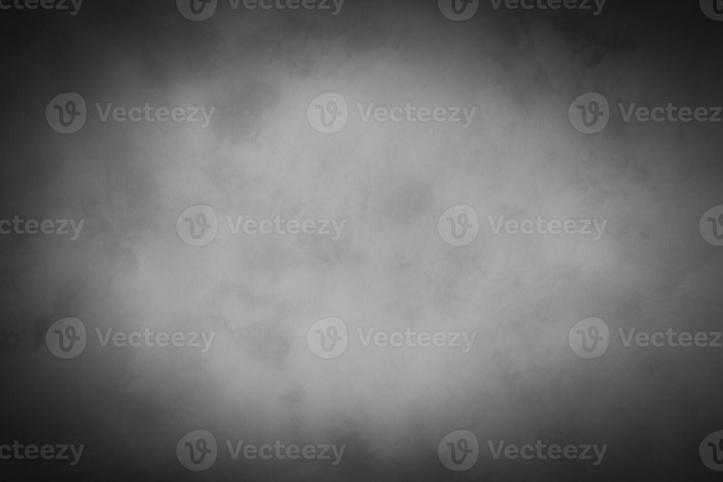 Blured gray decorative plaster or concrete background with vignette. photo