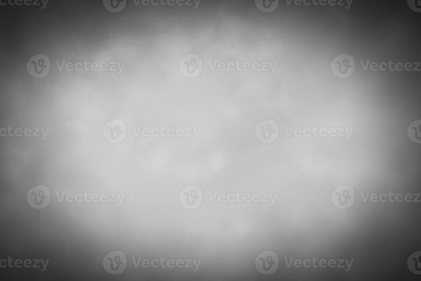 Blured gray decorative plaster or concrete background with vignette. photo