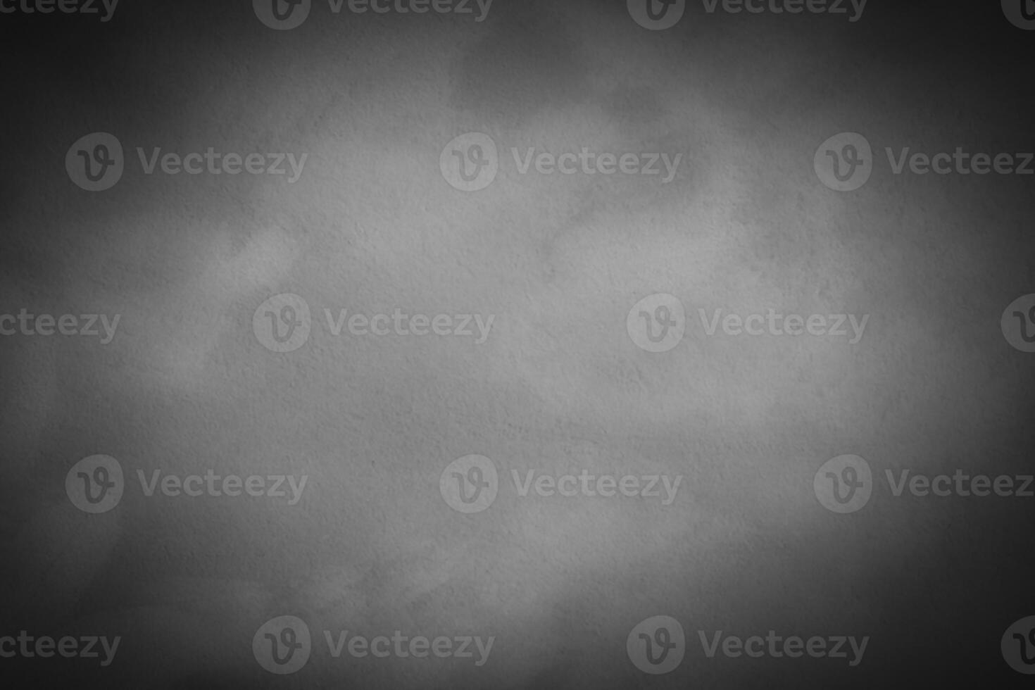 Blured gray decorative plaster or concrete background with vignette. photo