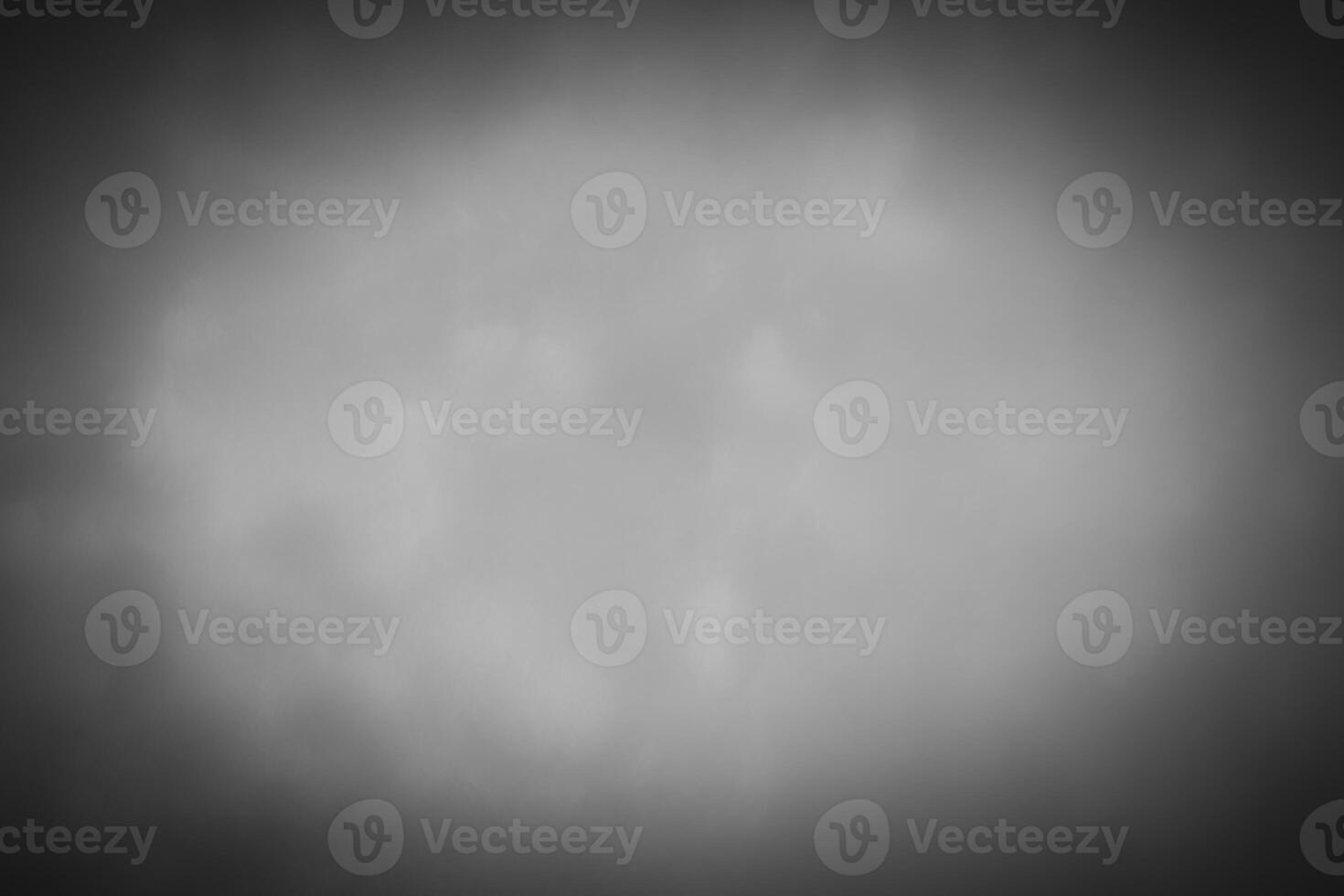 Blured gray decorative plaster or concrete background with vignette. photo
