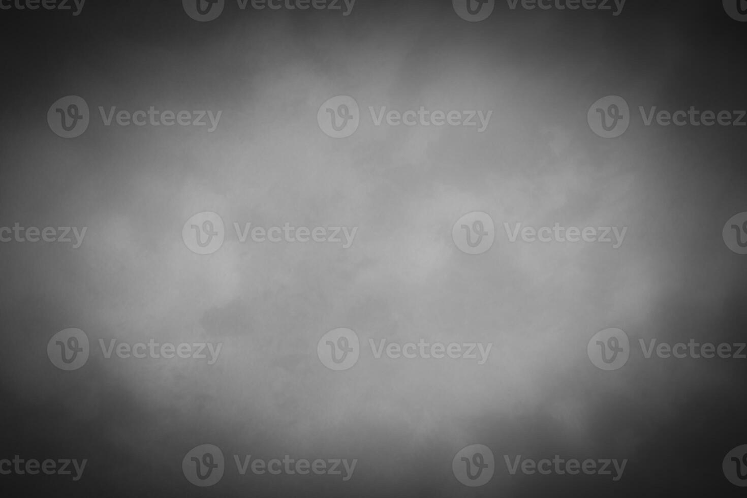 Blured gray decorative plaster or concrete background with vignette. photo