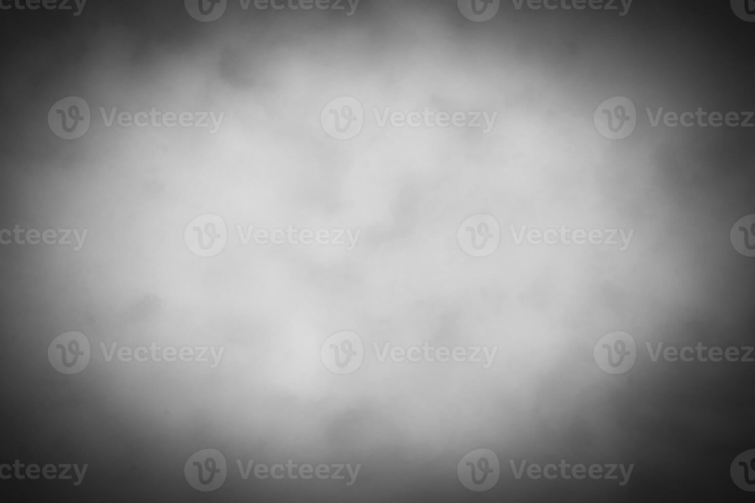 Blured gray decorative plaster or concrete background with vignette. photo
