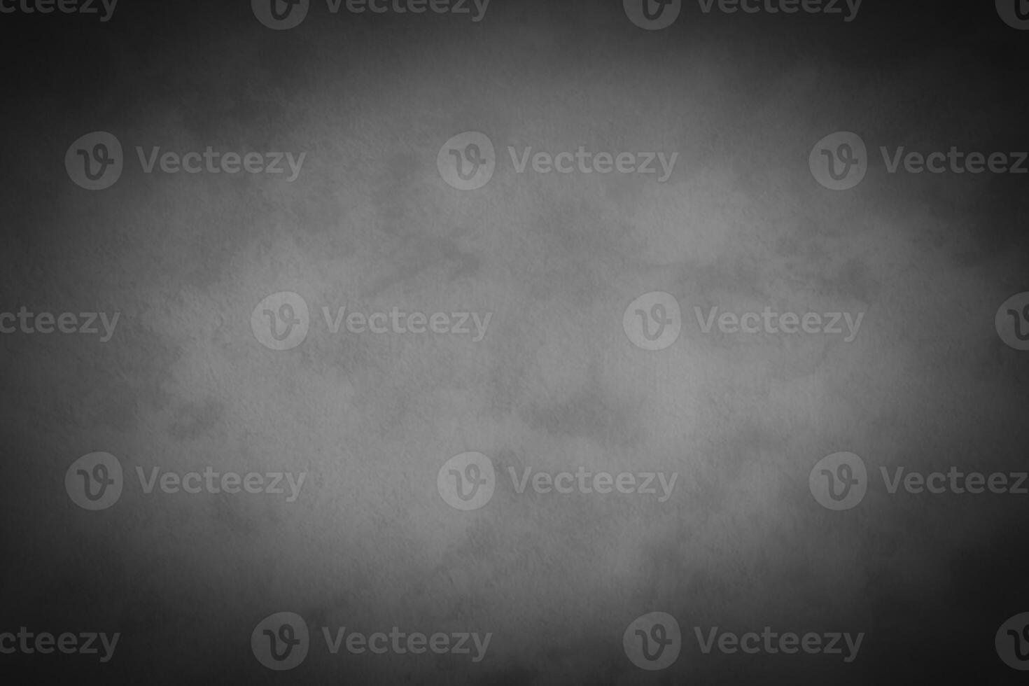 Blured gray decorative plaster or concrete background with vignette. photo