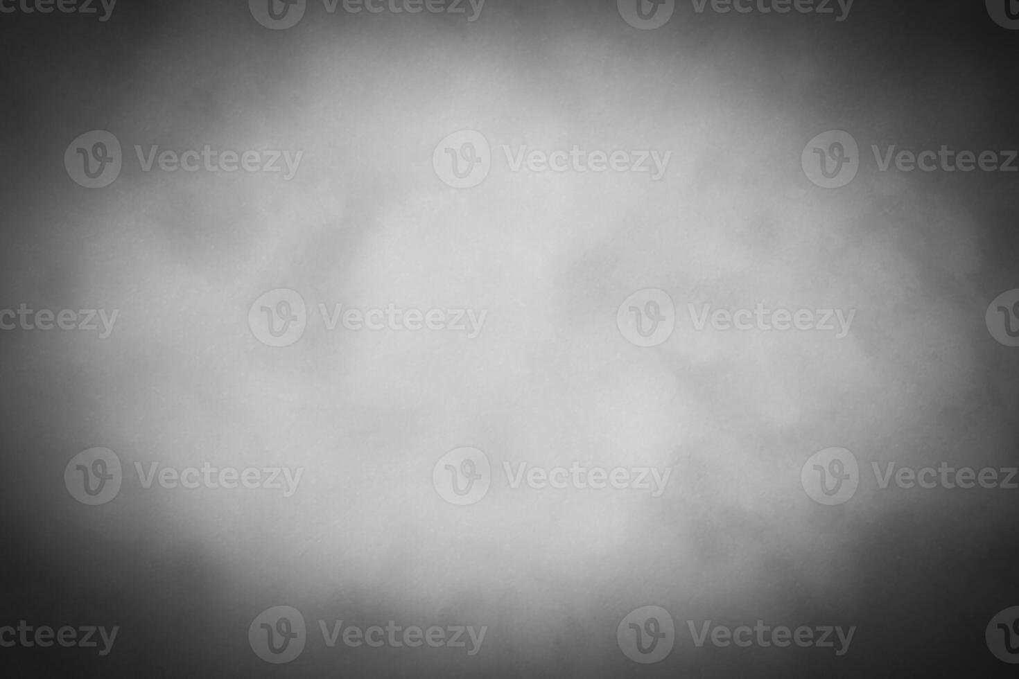 Blured gray decorative plaster or concrete background with vignette. photo