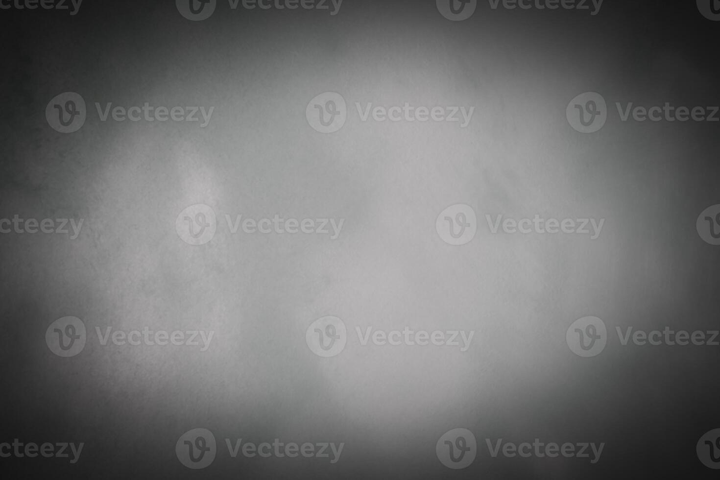 Blured gray decorative plaster or concrete background with vignette. photo