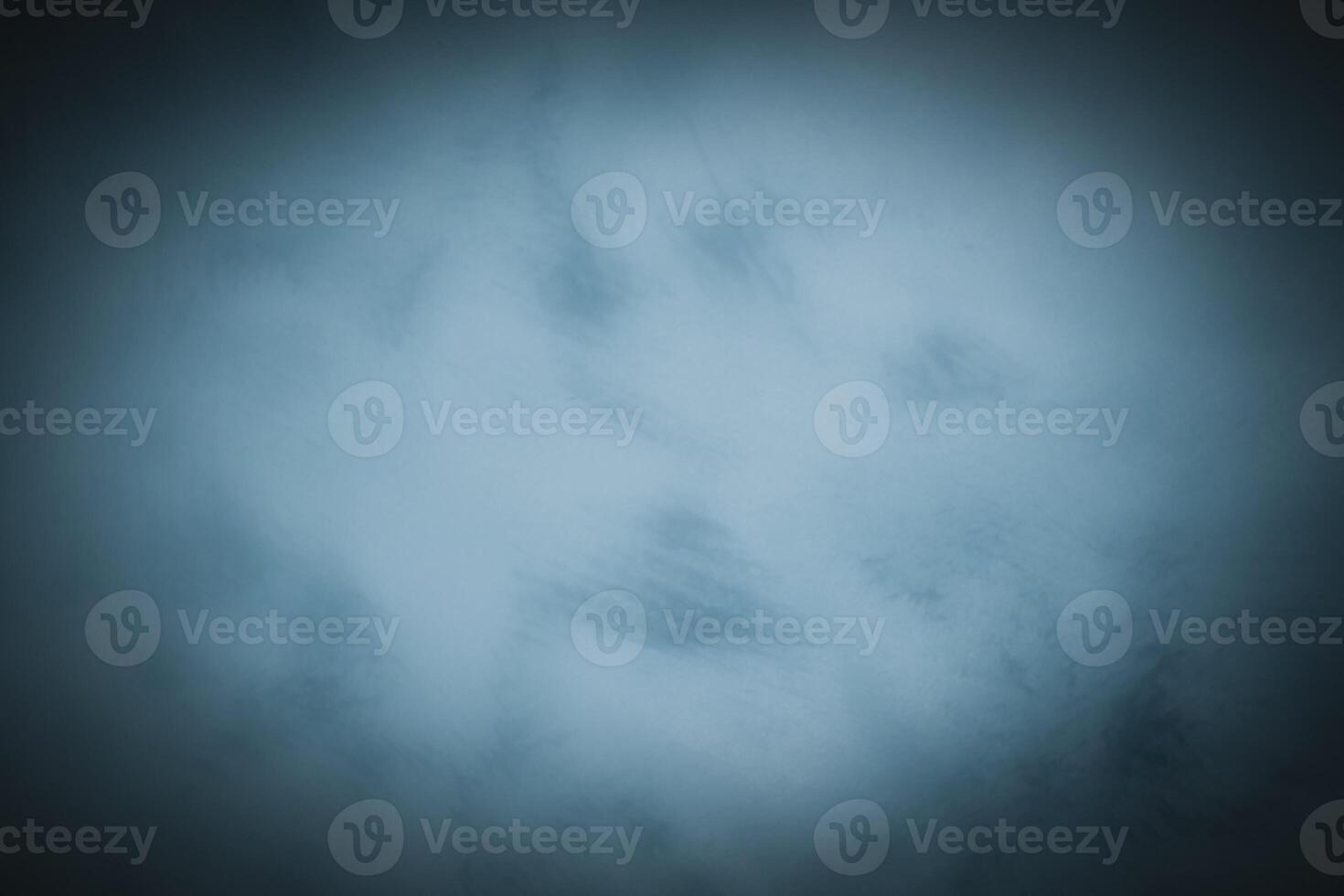 Blured monochrome decorative plaster or concrete background with vignette. photo