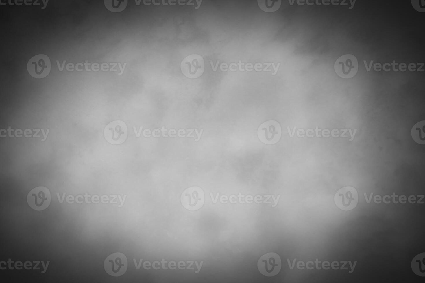Blured gray decorative plaster or concrete background with vignette. photo
