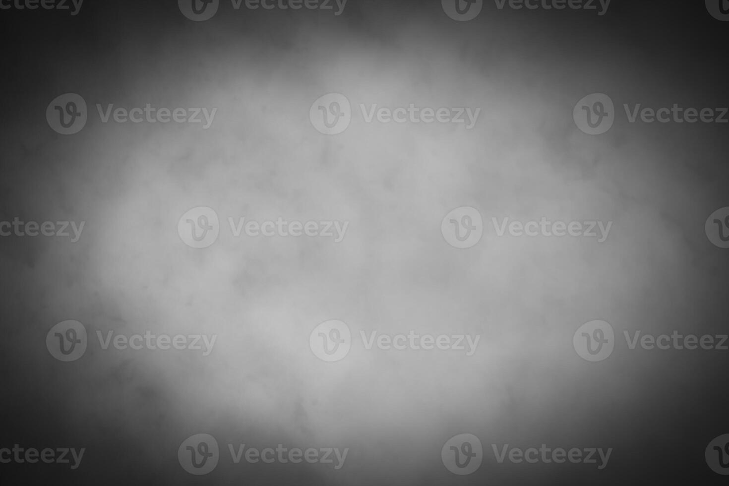 Blured gray decorative plaster or concrete background with vignette. photo