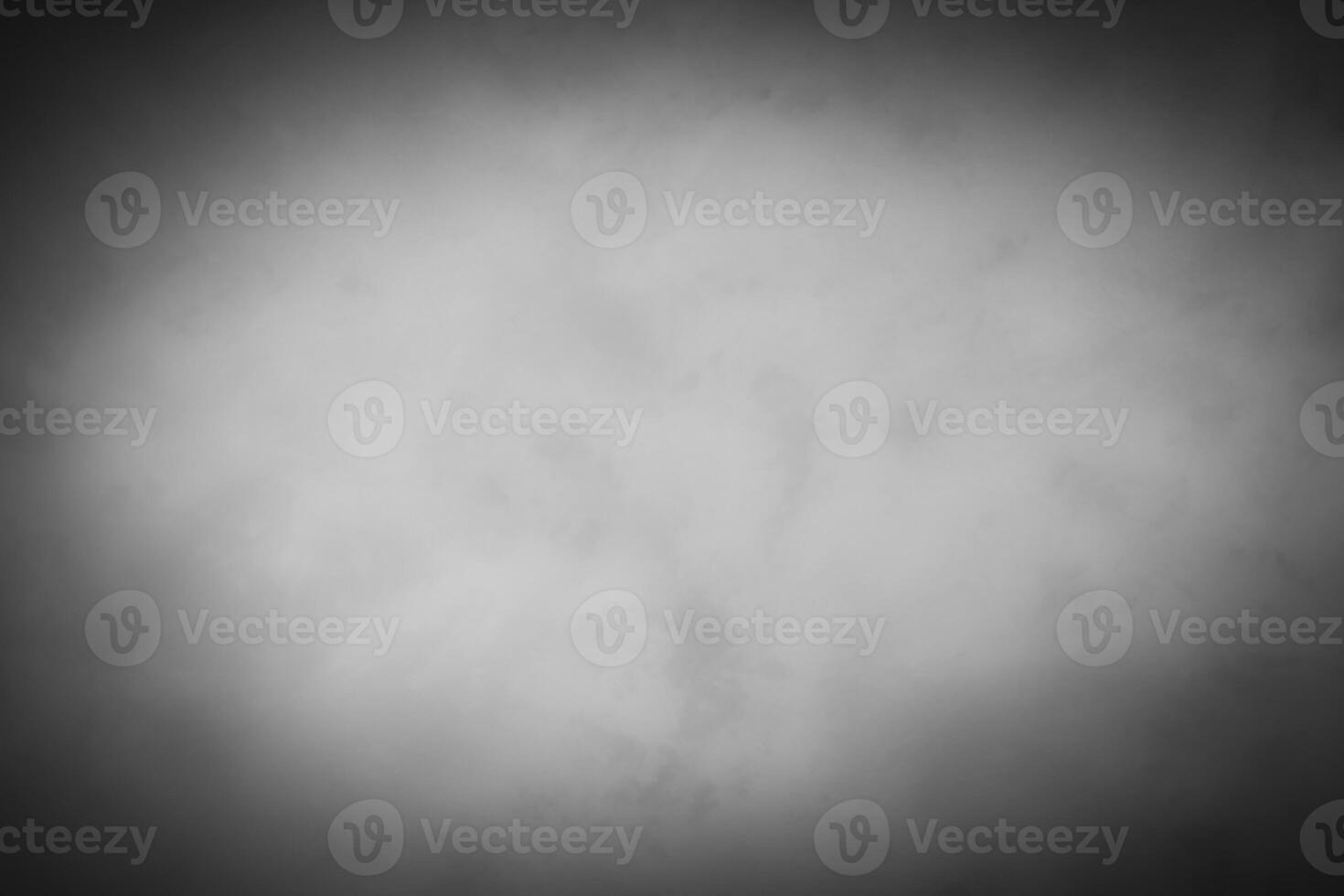 Blured gray decorative plaster or concrete background with vignette. photo
