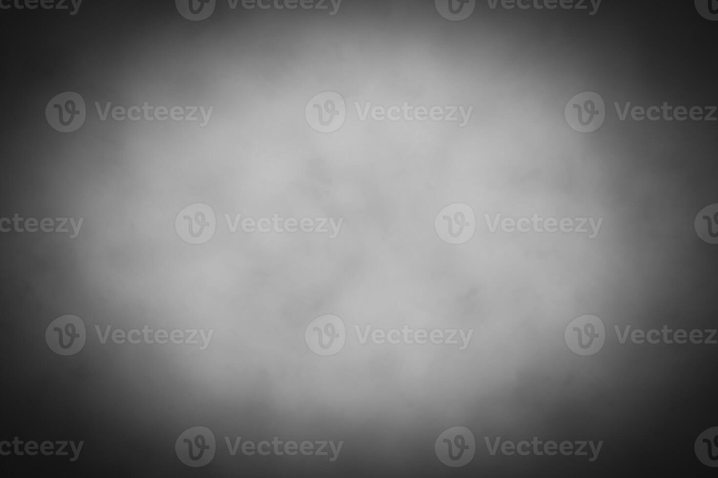 Blured gray decorative plaster or concrete background with vignette. photo