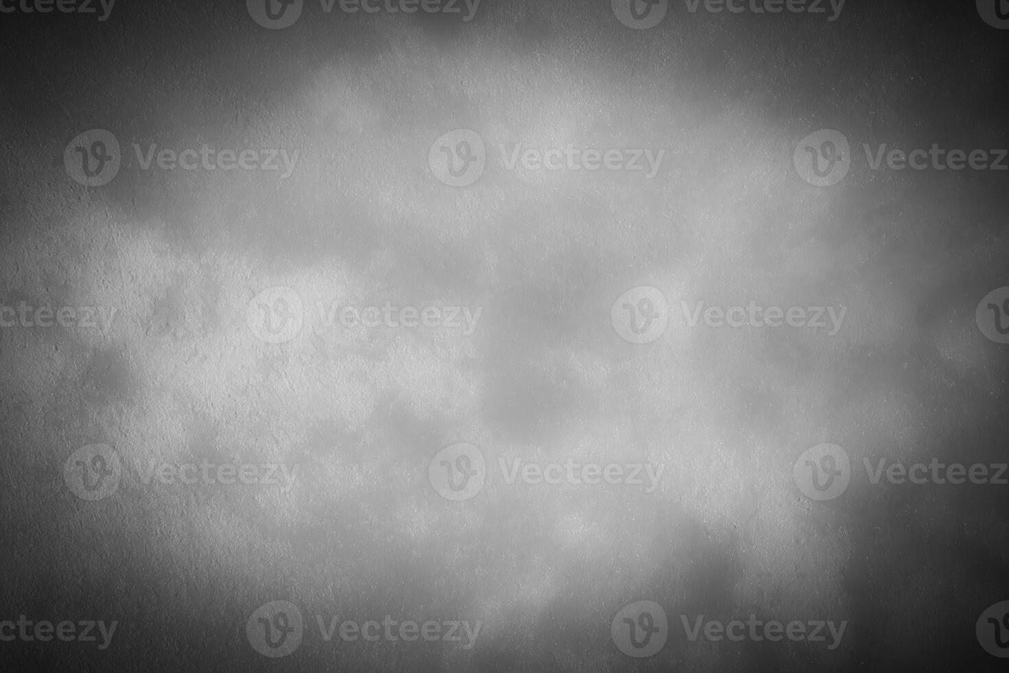 Gray decorative plaster or concrete background with vignette. photo