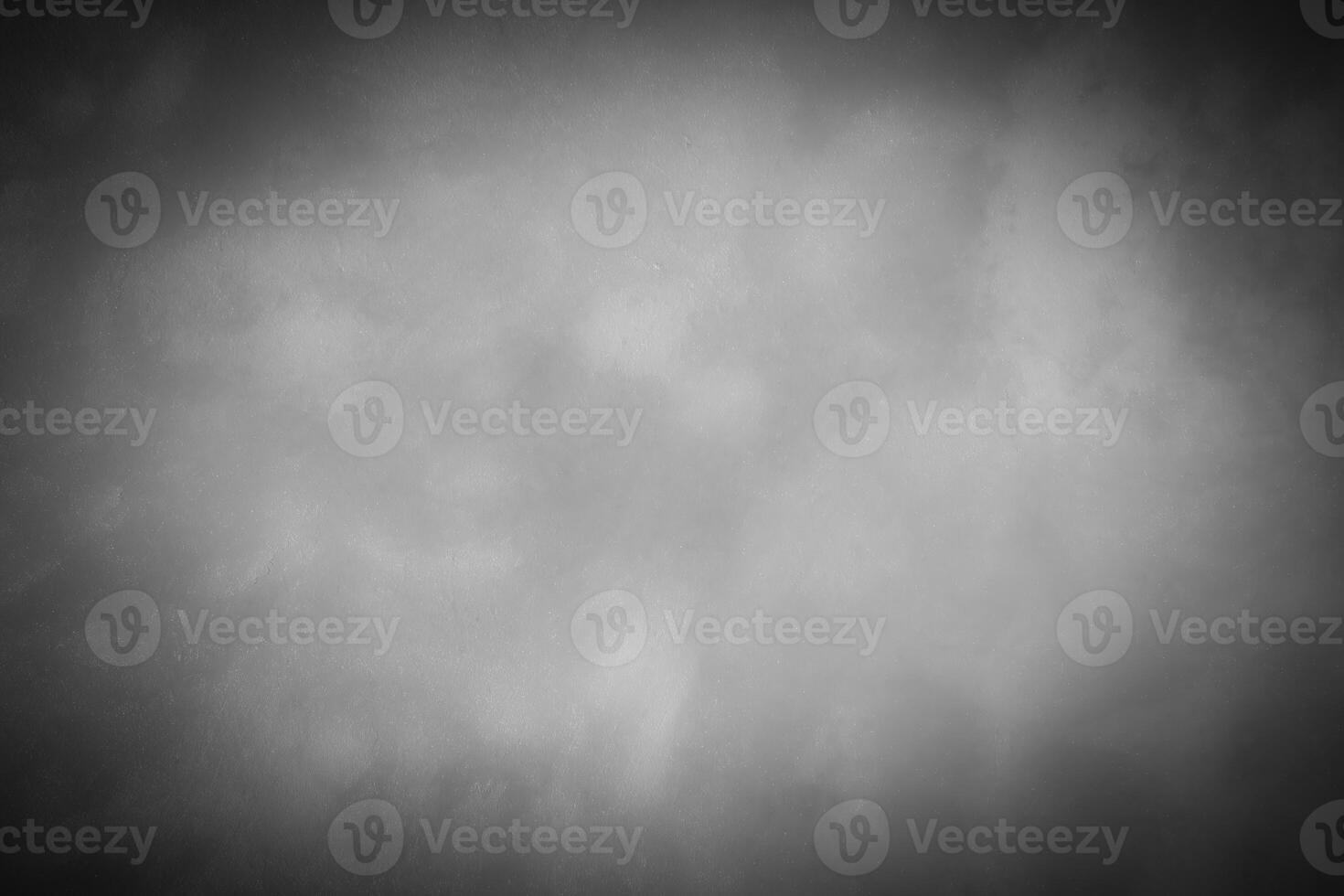 Gray decorative plaster or concrete background with vignette. photo
