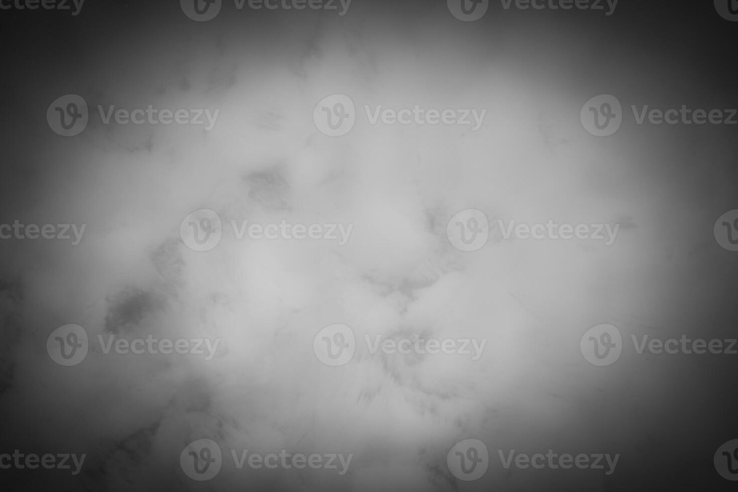 Blured gray decorative plaster or concrete background with vignette. photo