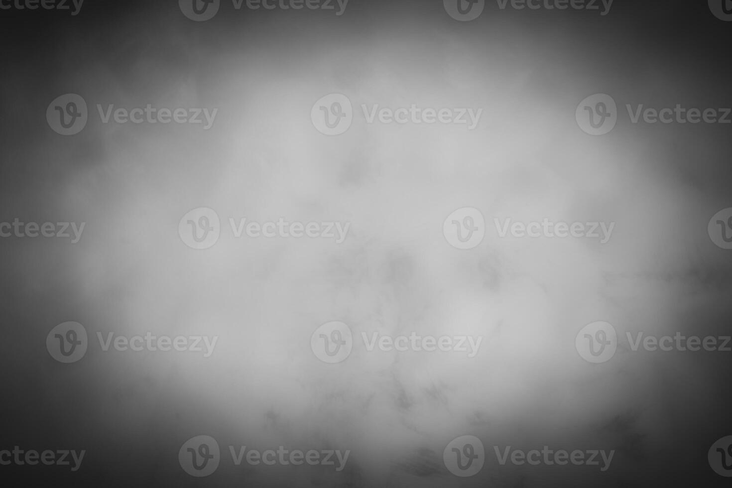 Blured gray decorative plaster or concrete background with vignette. photo