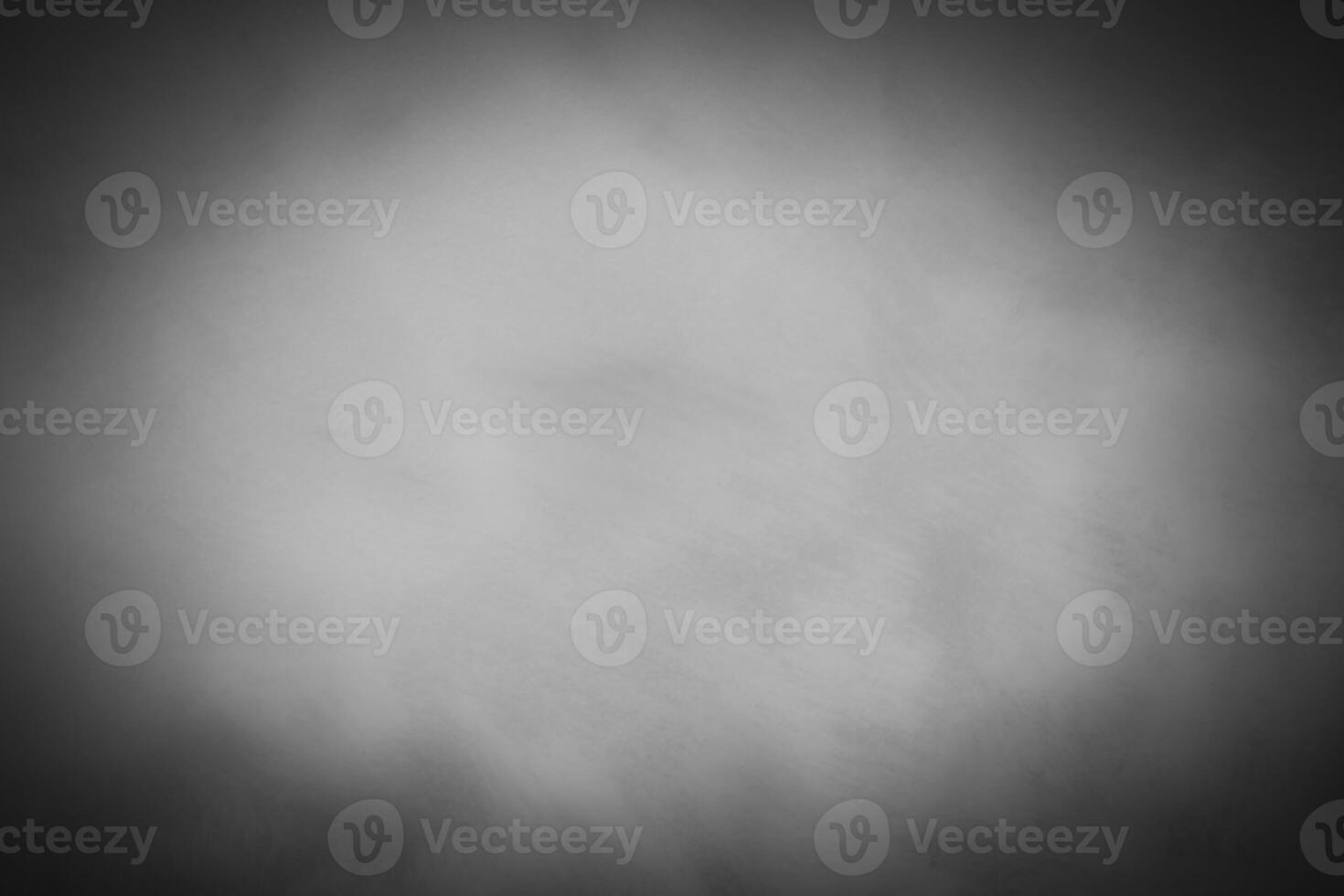 Blured gray decorative plaster or concrete background with vignette. photo