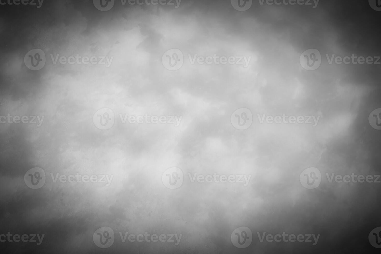 Gray decorative plaster or concrete background with vignette. photo