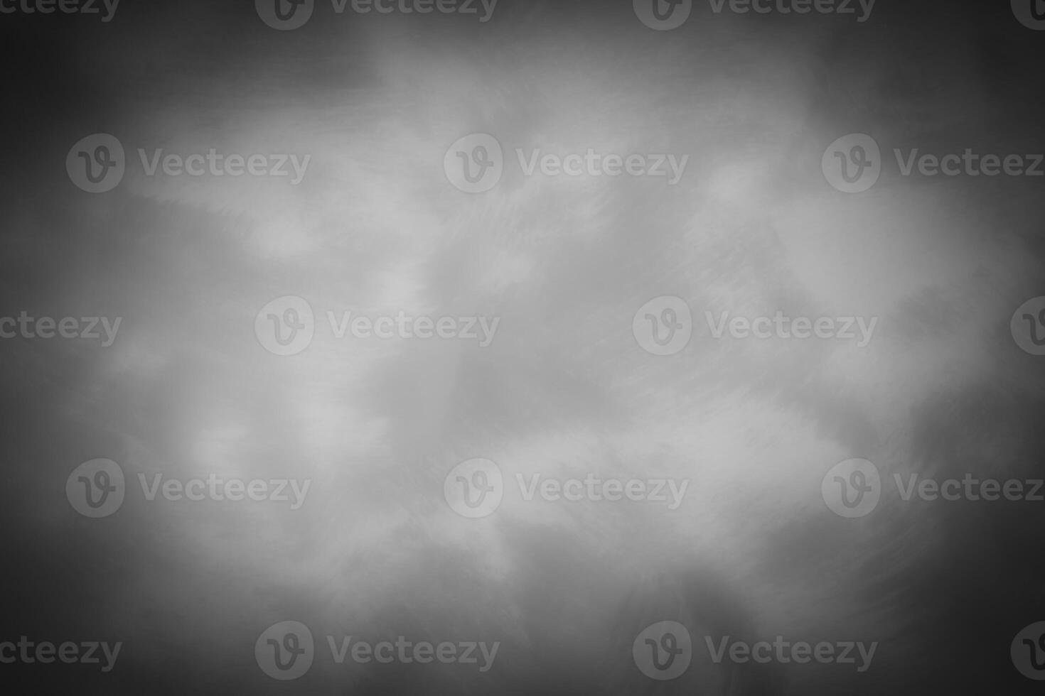 Blured gray decorative plaster or concrete background with vignette. photo