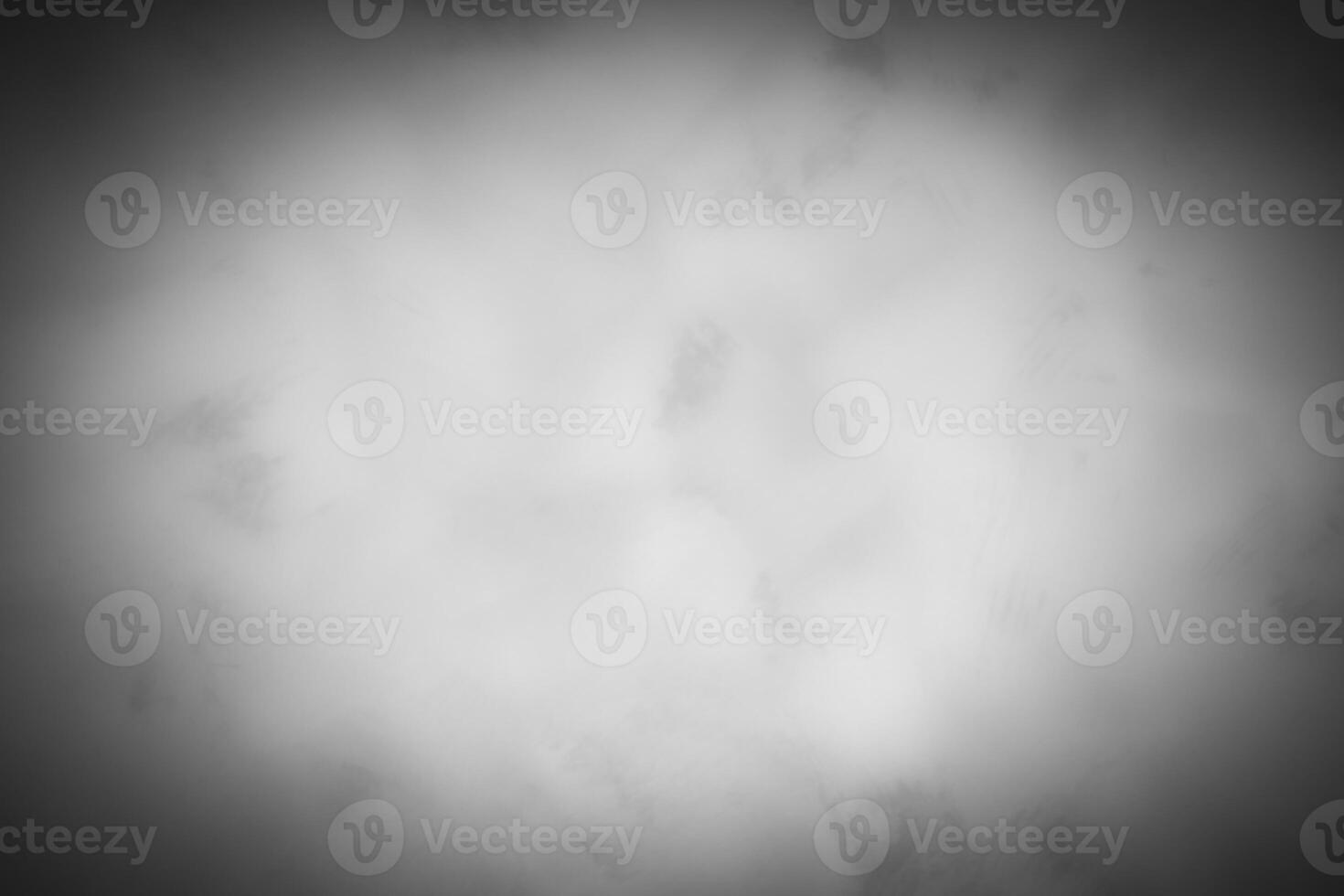 Blured gray decorative plaster or concrete background with vignette. photo