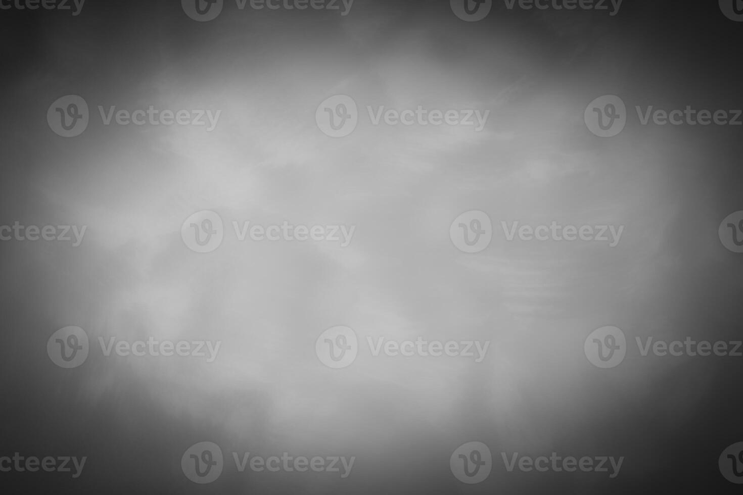Blured gray decorative plaster or concrete background with vignette. photo