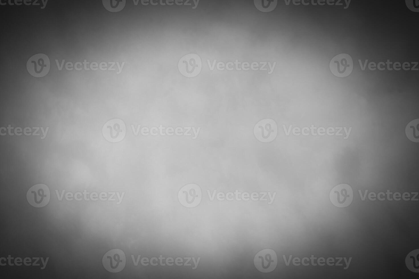 Blured gray decorative plaster or concrete background with vignette. photo