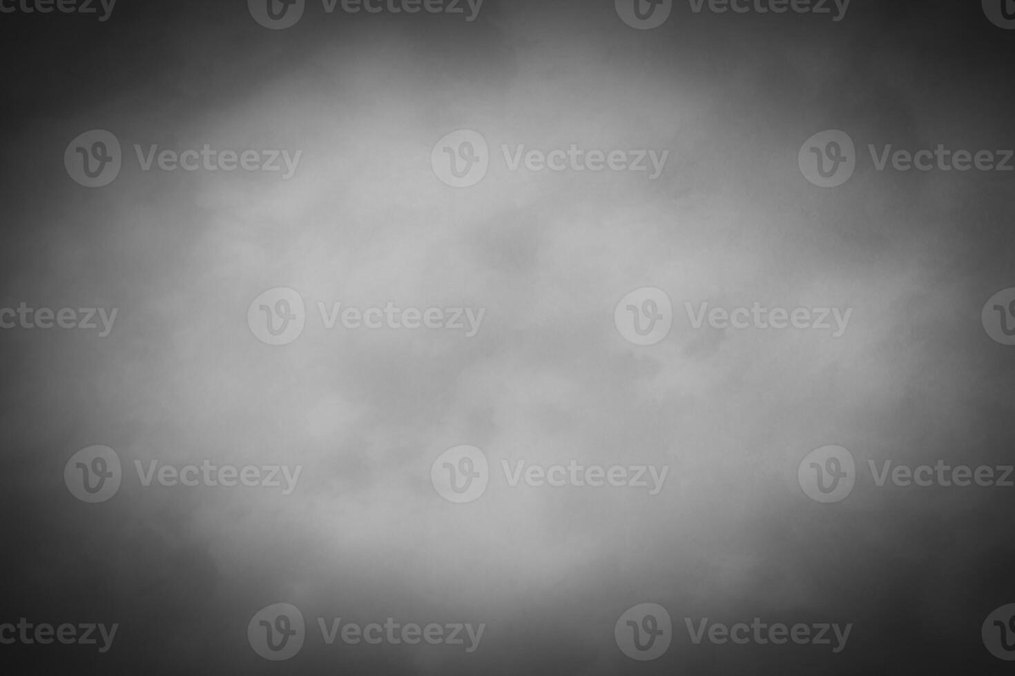 Blured gray decorative plaster or concrete background with vignette. photo