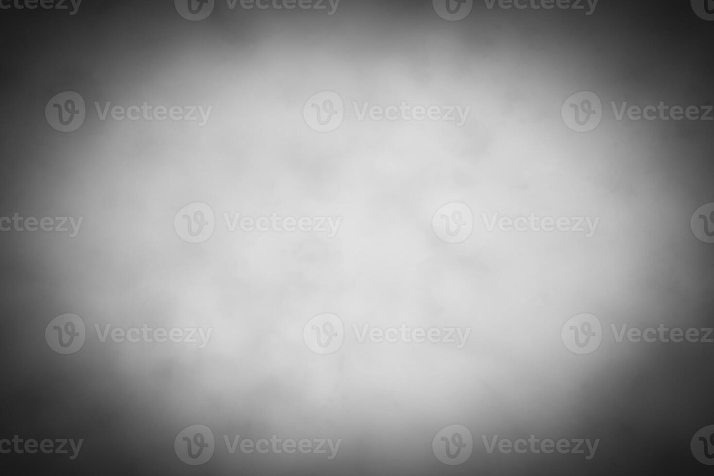Blured gray decorative plaster or concrete background with vignette. photo