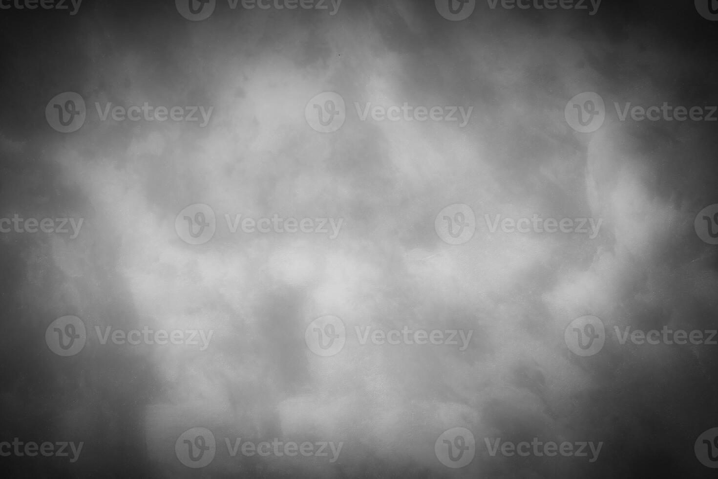 Gray decorative plaster or concrete background with vignette. photo