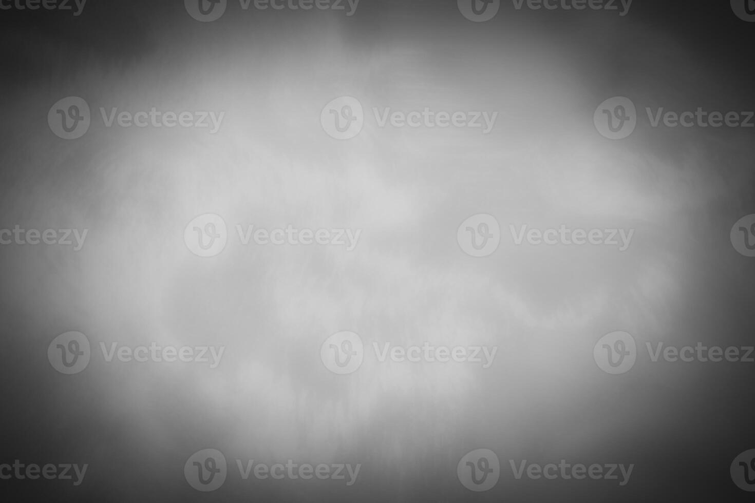 Blured gray decorative plaster or concrete background with vignette. photo