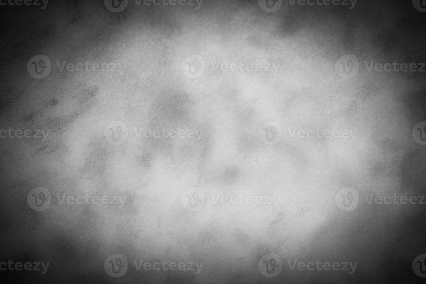 Gray decorative plaster or concrete background with vignette. photo