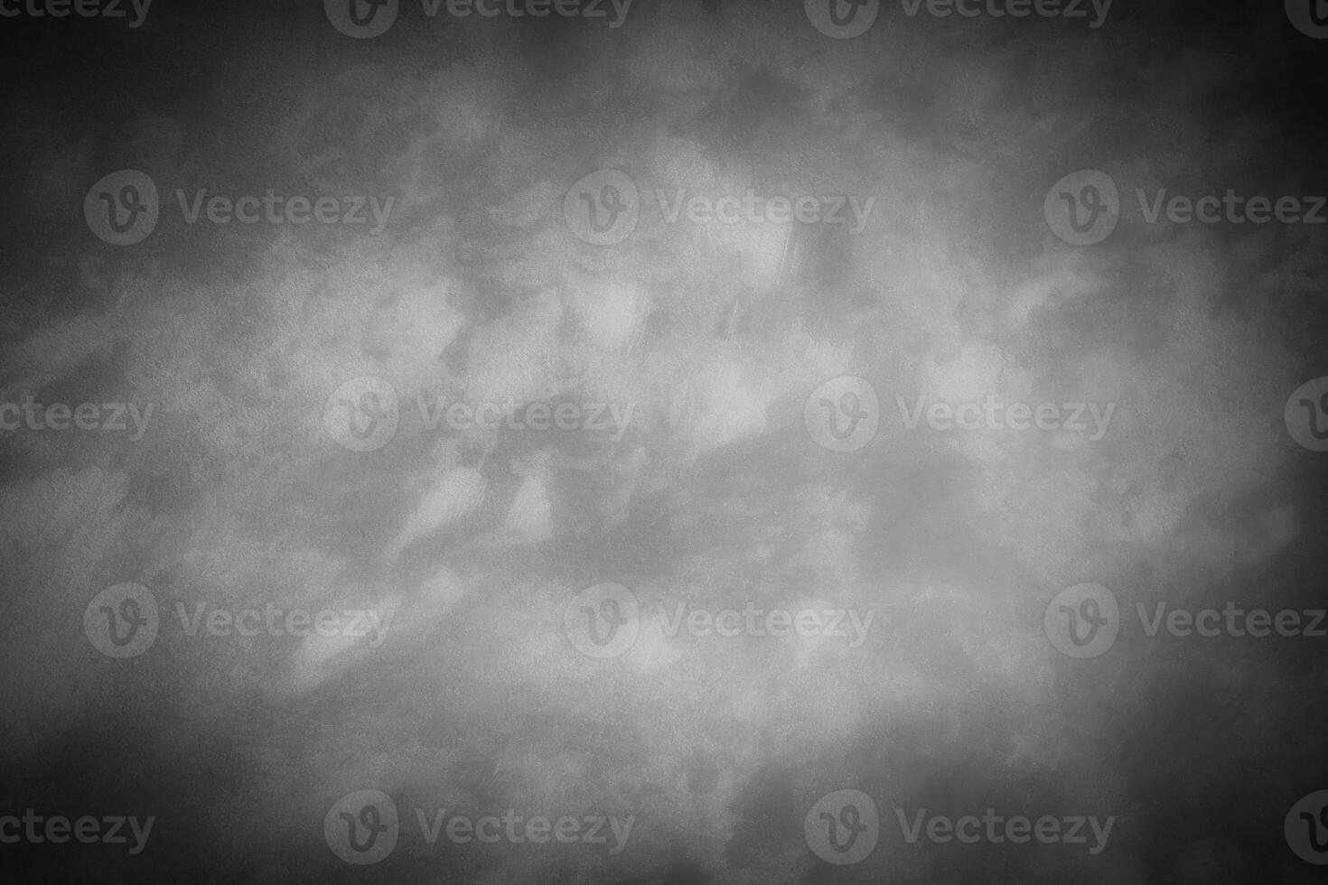 Gray decorative plaster or concrete background with vignette. photo