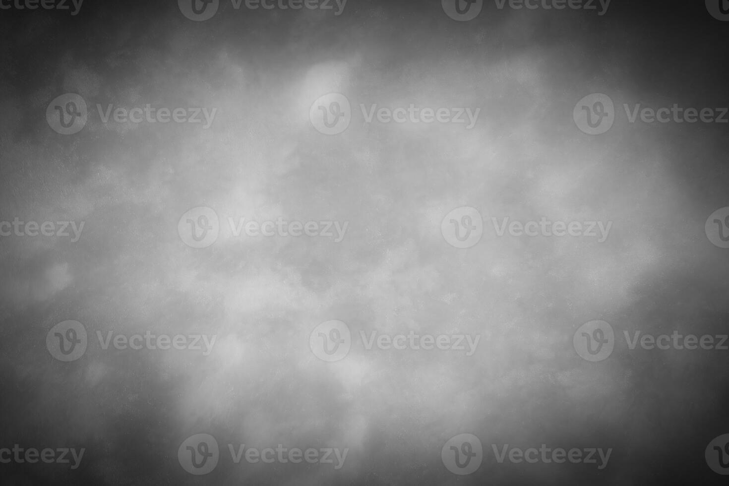 Gray decorative plaster or concrete background with vignette. photo