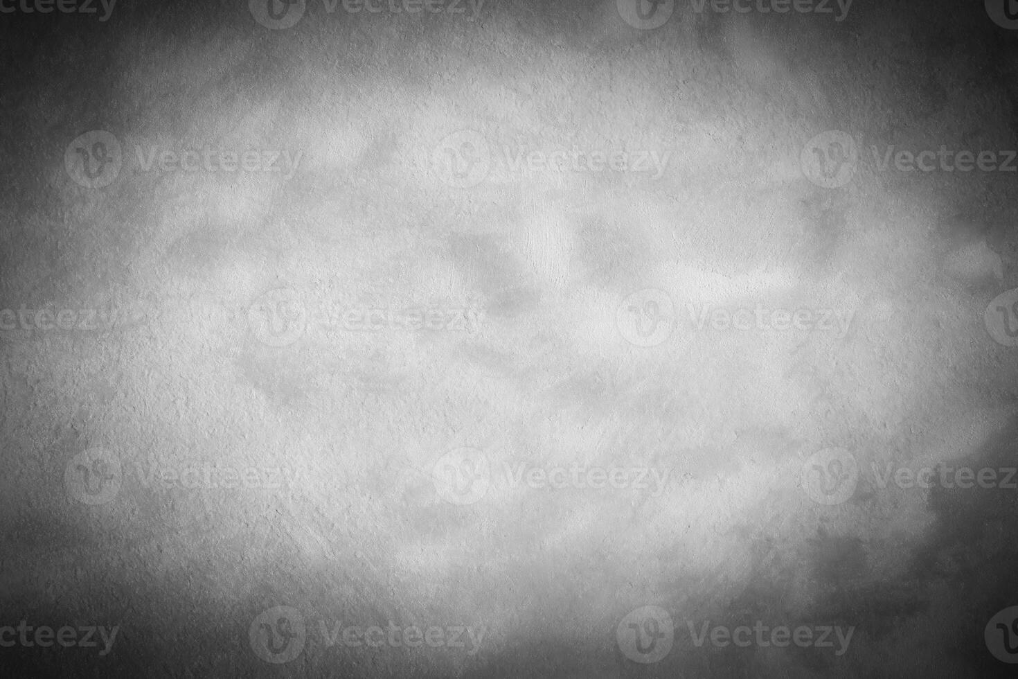 Gray decorative plaster or concrete background with vignette. photo