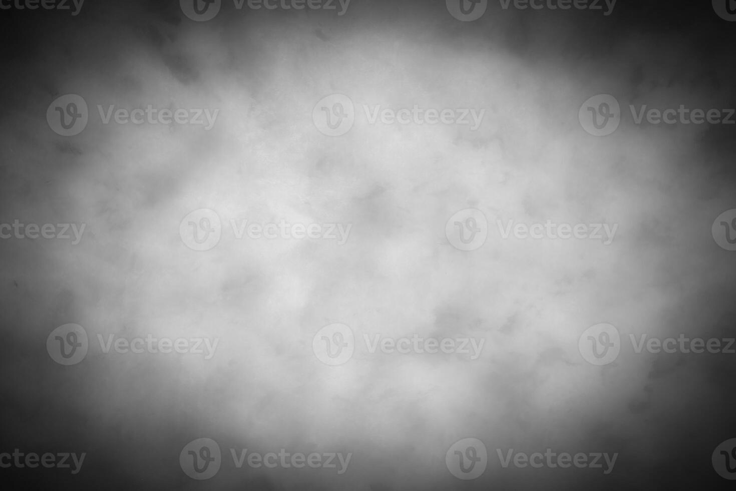 Gray decorative plaster or concrete background with vignette. photo