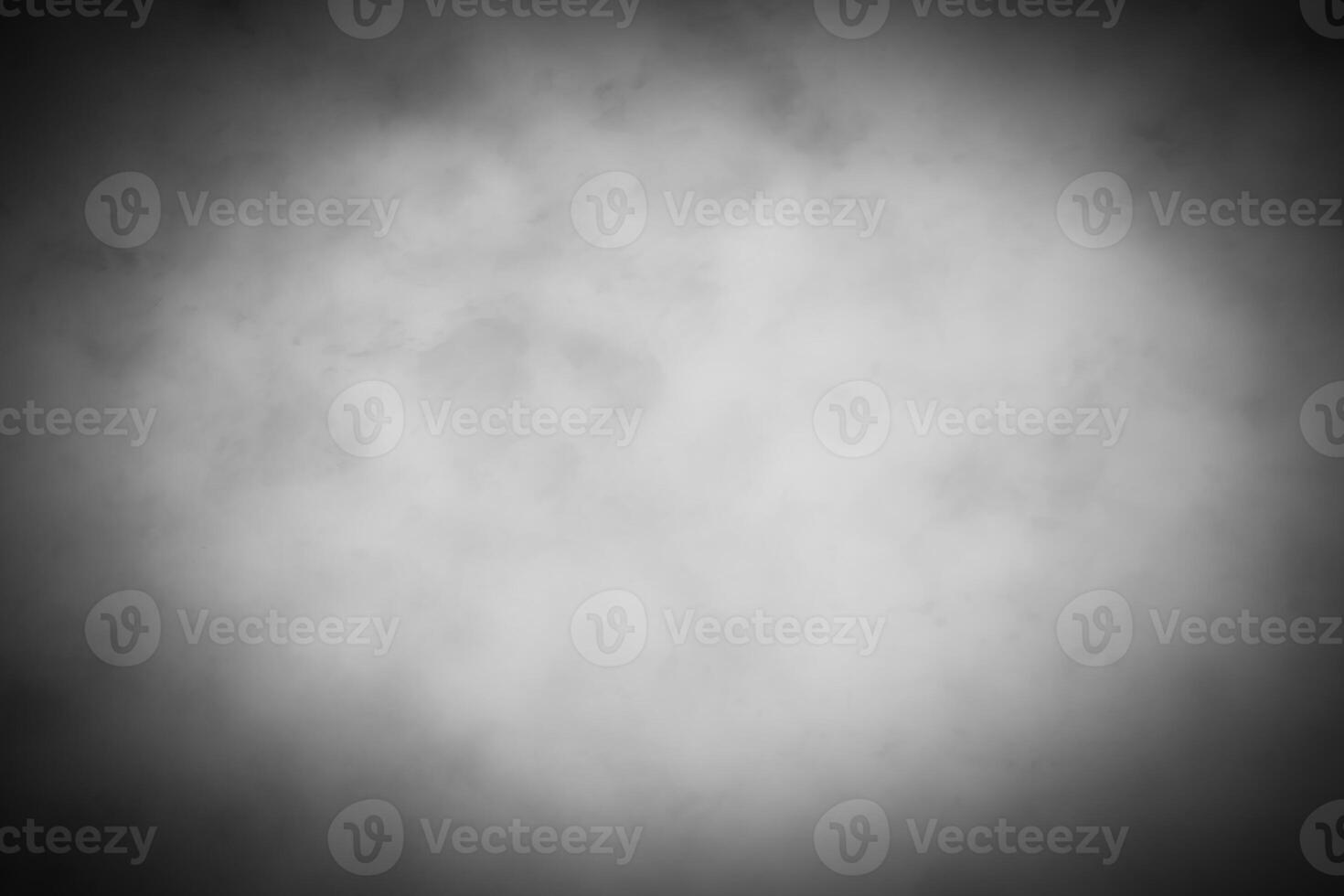 Gray decorative plaster or concrete background with vignette. photo