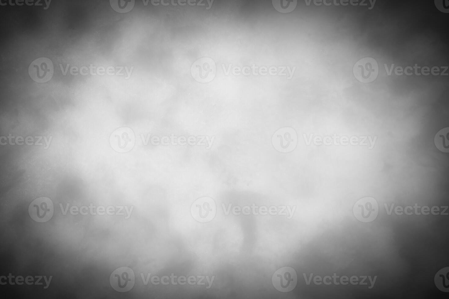 Gray decorative plaster or concrete background with vignette. photo