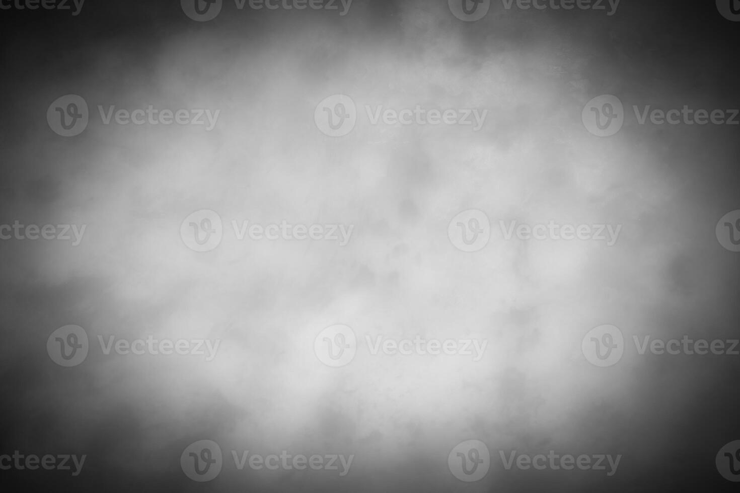 Gray decorative plaster or concrete background with vignette. photo