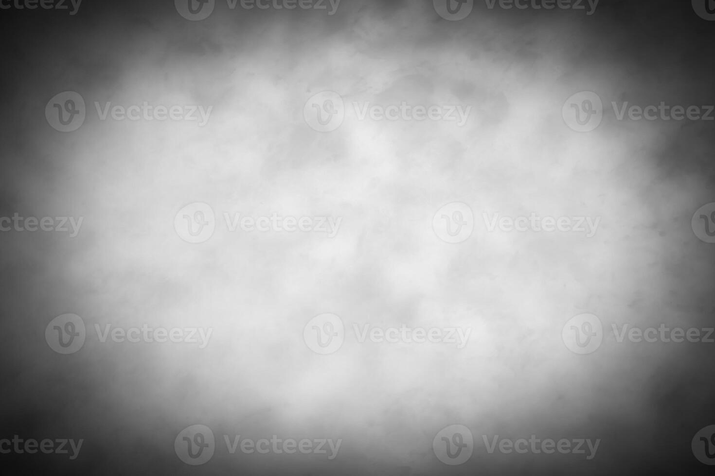 Gray decorative plaster or concrete background with vignette. photo