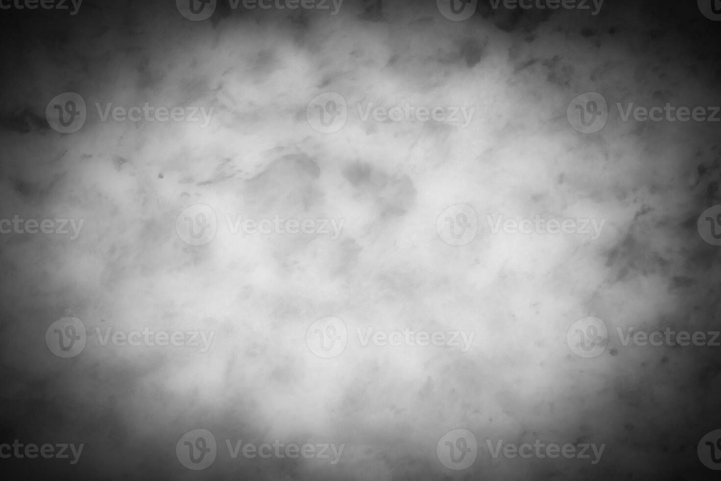 Gray decorative plaster or concrete background with vignette. photo