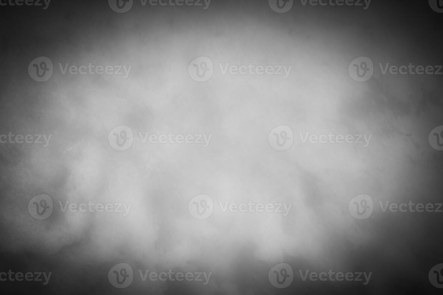 Gray decorative plaster or concrete background with vignette. photo