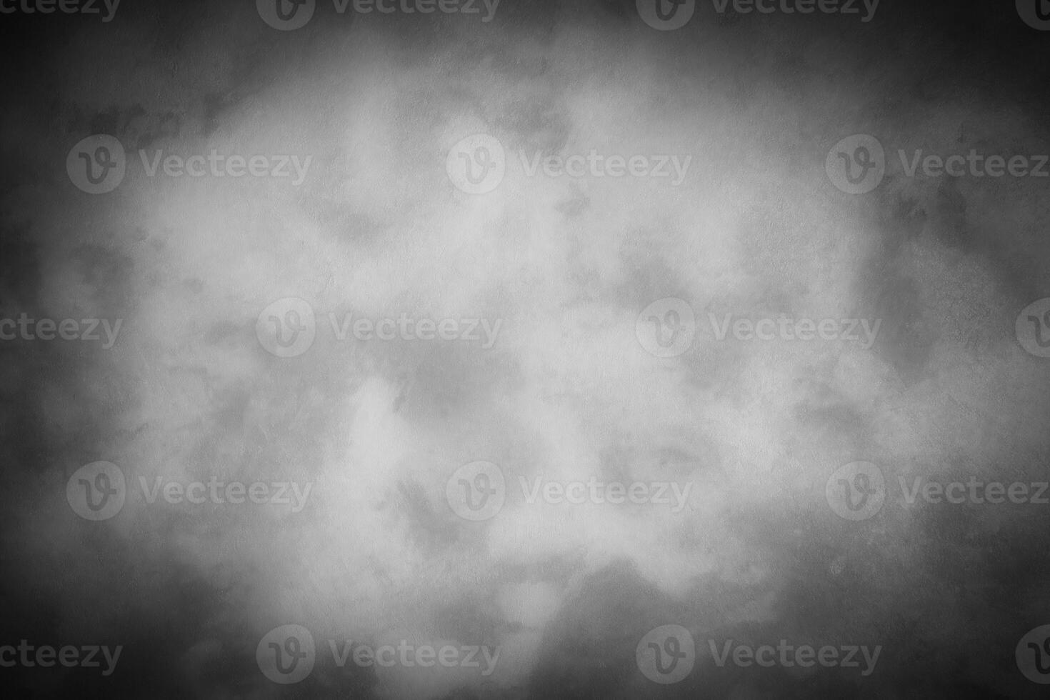 Gray decorative plaster or concrete background with vignette. photo
