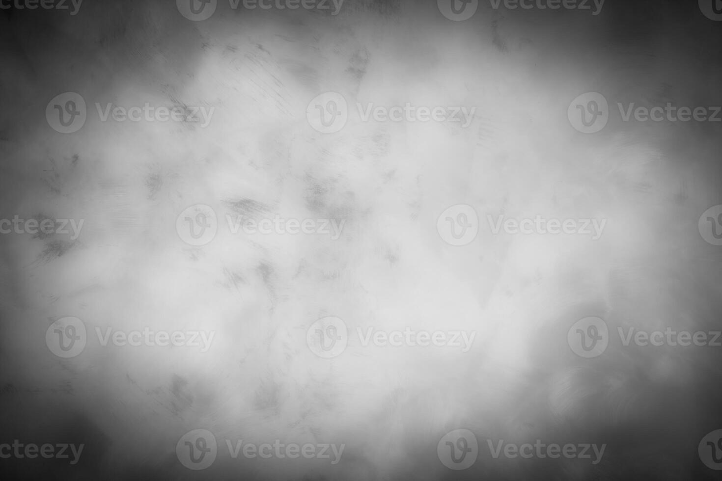 Gray decorative plaster or concrete background with vignette. photo