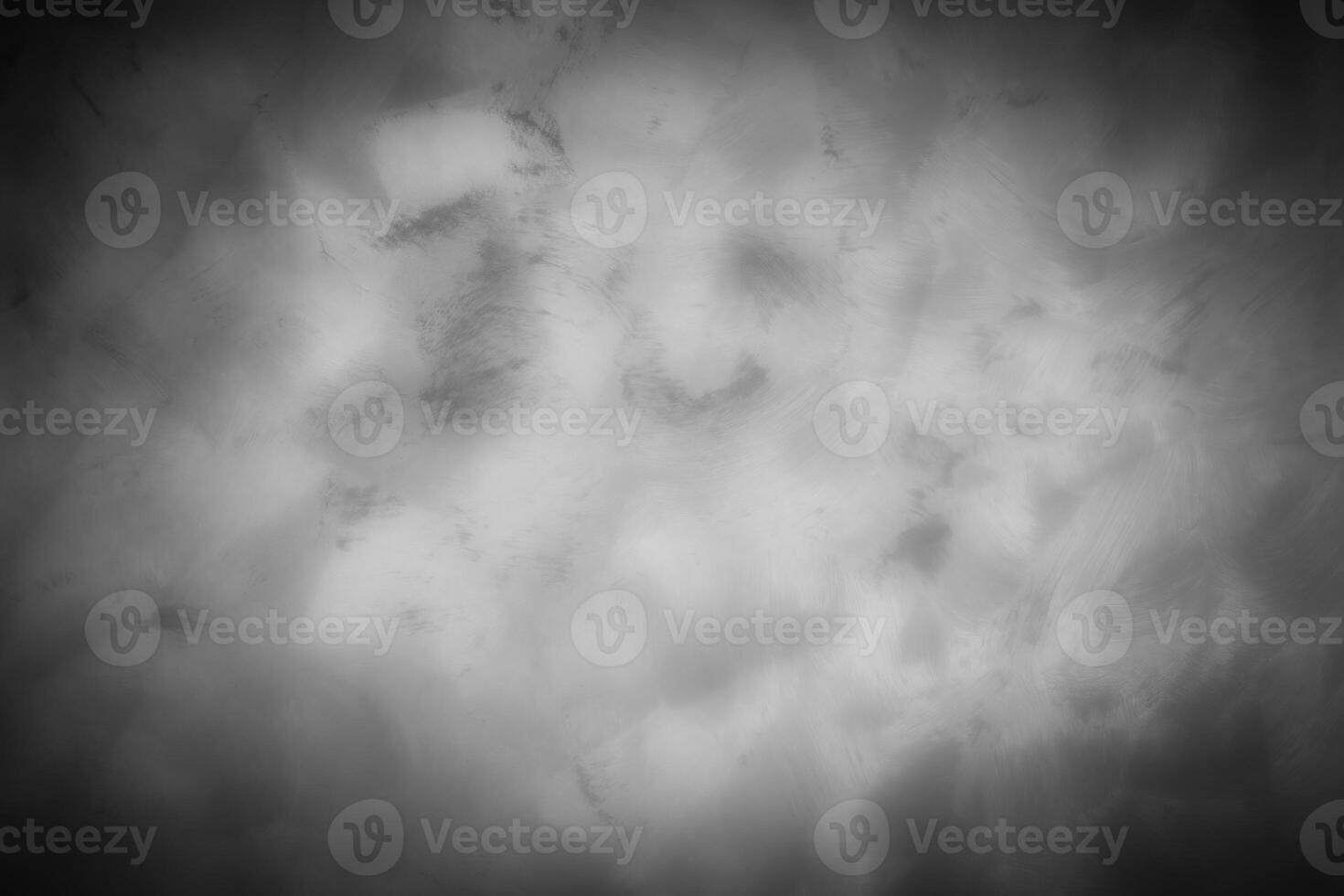 Gray decorative plaster or concrete background with vignette. photo