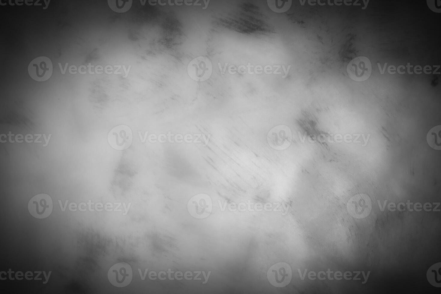 Gray decorative plaster or concrete background with vignette. photo