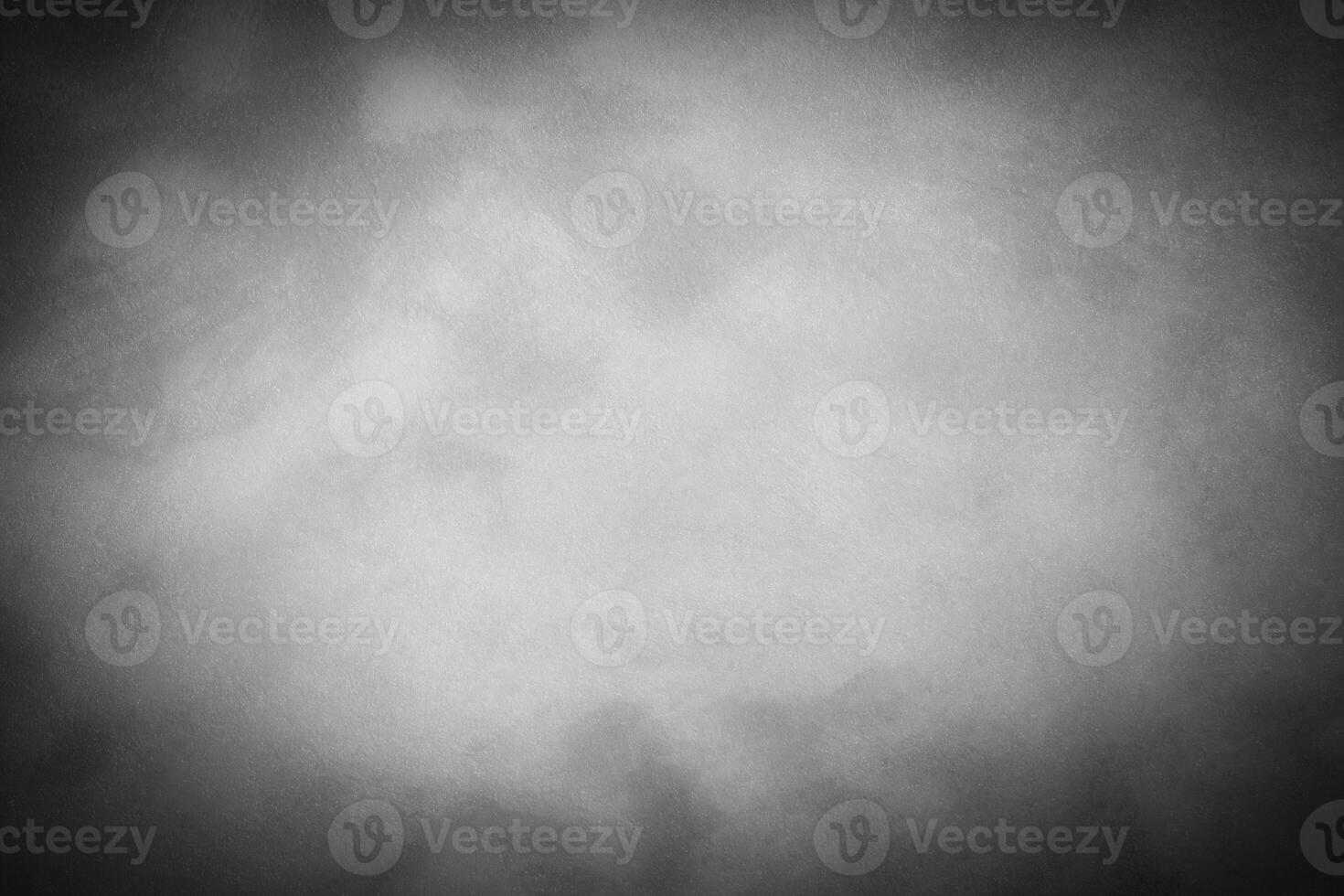 Gray decorative plaster or concrete background with vignette. photo