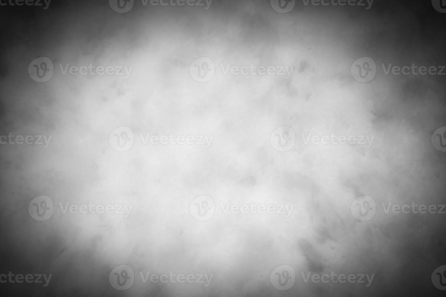 Gray decorative plaster or concrete background with vignette. photo