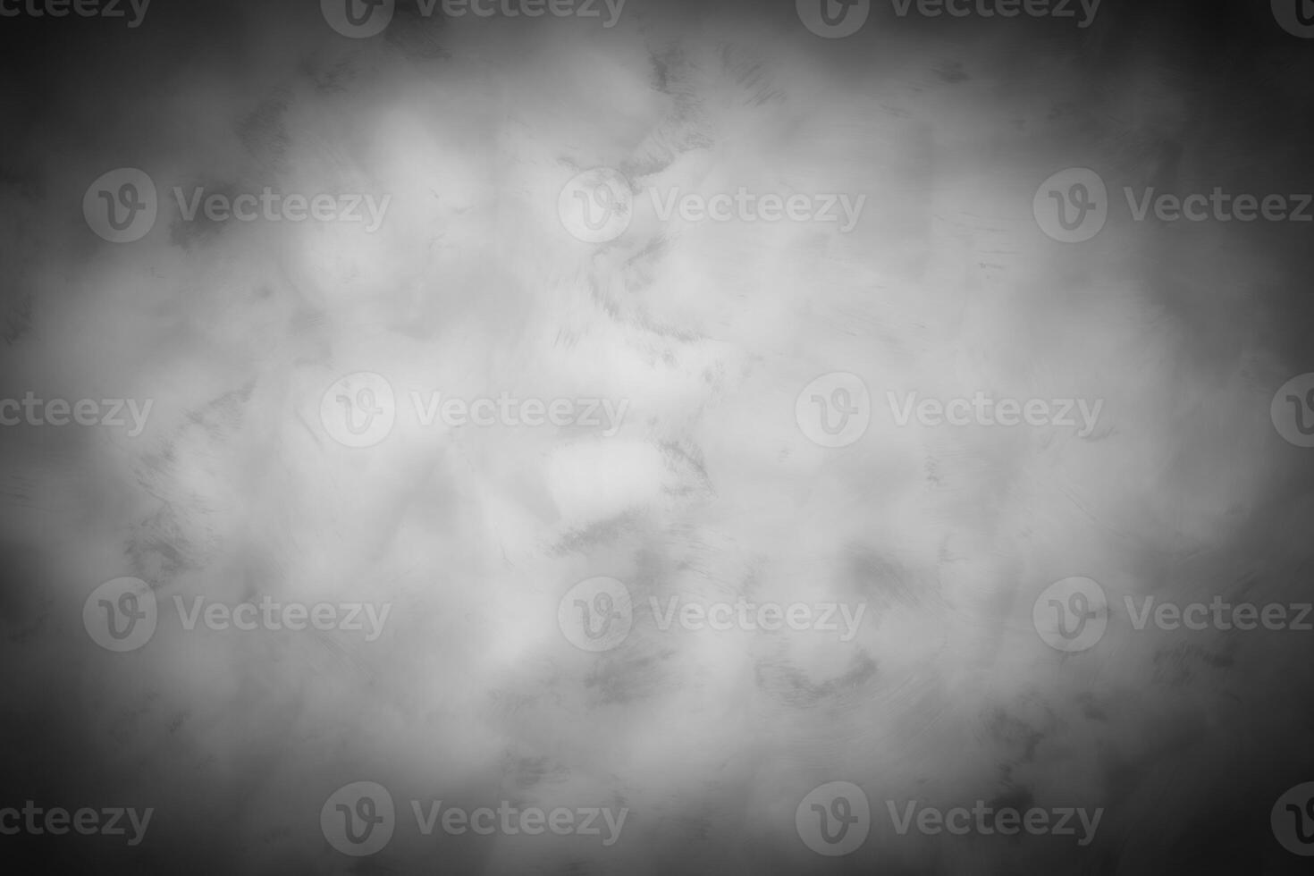 Gray decorative plaster or concrete background with vignette. photo