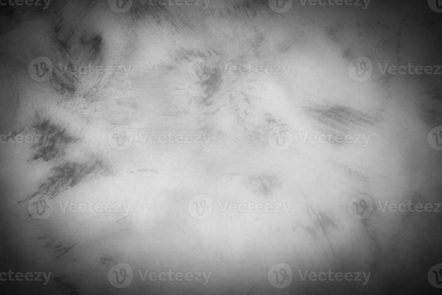 Gray decorative plaster or concrete background with vignette. photo