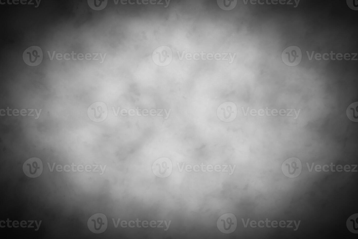 Gray decorative plaster or concrete background with vignette. photo